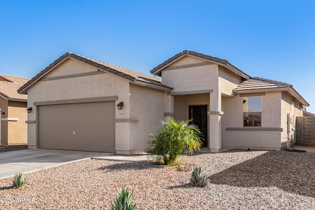 single story home featuring a garage