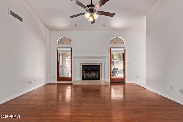 15430 N 19th Way, Phoenix, AZ 85022 - unfurnished living room featuring wood finished floors, ceiling fan, a premium fireplace, and baseboards