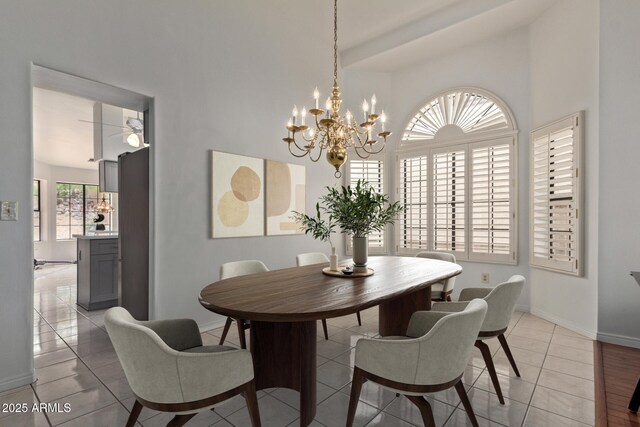 15430 N 19th Way, Phoenix, AZ 85022 - dining space with a high ceiling, baseboards, a chandelier, and light tile patterned flooring