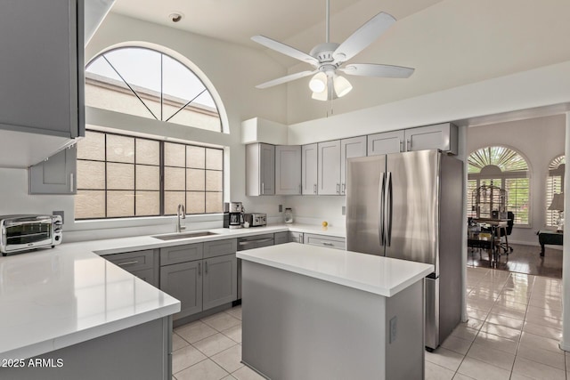 15430 N 19th Way, Phoenix, AZ 85022 - kitchen featuring gray cabinets, stainless steel appliances, a sink, light tile patterned flooring, and light countertops
