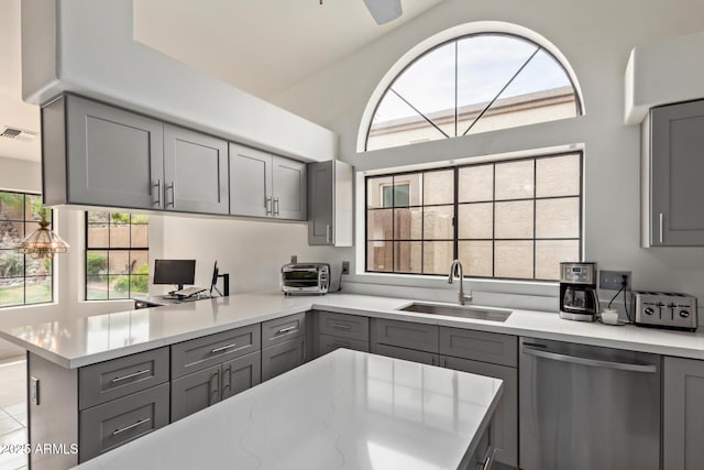 15430 N 19th Way, Phoenix, AZ 85022 - kitchen with gray cabinetry, dishwasher, a sink, a peninsula, and lofted ceiling
