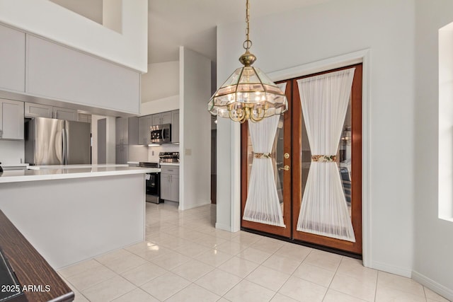 15430 N 19th Way, Phoenix, AZ 85022 - kitchen featuring appliances with stainless steel finishes, gray cabinets, a chandelier, light countertops, and baseboards