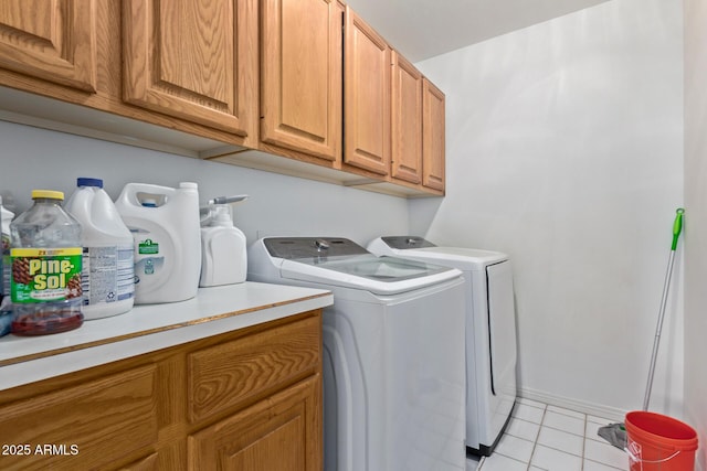 15430 N 19th Way, Phoenix, AZ 85022 - washroom featuring cabinet space, washer and clothes dryer, light tile patterned floors, and baseboards