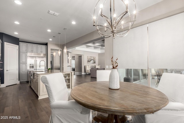 dining room with visible vents, recessed lighting, a notable chandelier, and dark wood finished floors