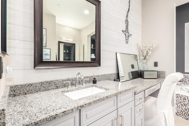 bathroom featuring a bath and vanity