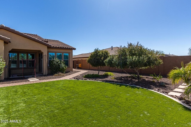 view of yard with a fenced backyard