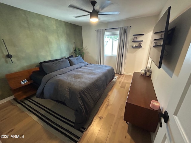 7802 E Hubbell St, Scottsdale, AZ 85257 - bedroom with light wood-style floors and a ceiling fan