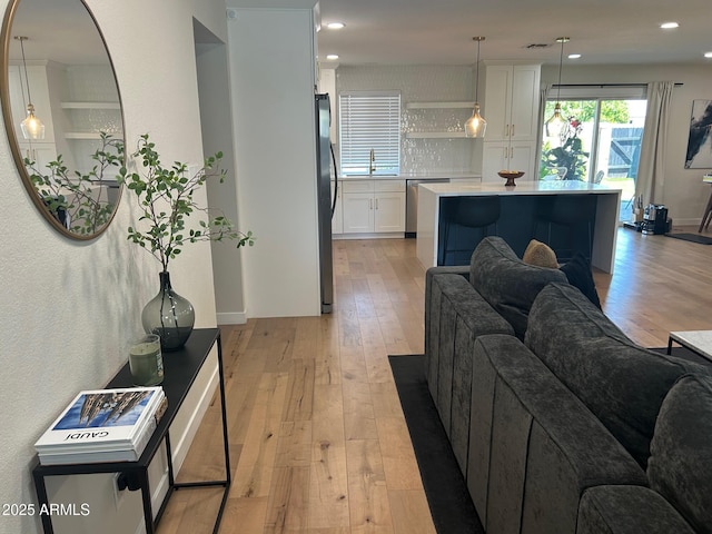 7802 E Hubbell St, Scottsdale, AZ 85257 - living area with light wood finished floors and recessed lighting