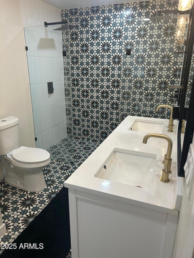 7802 E Hubbell St, Scottsdale, AZ 85257 - bathroom featuring double vanity, toilet, and a tile shower