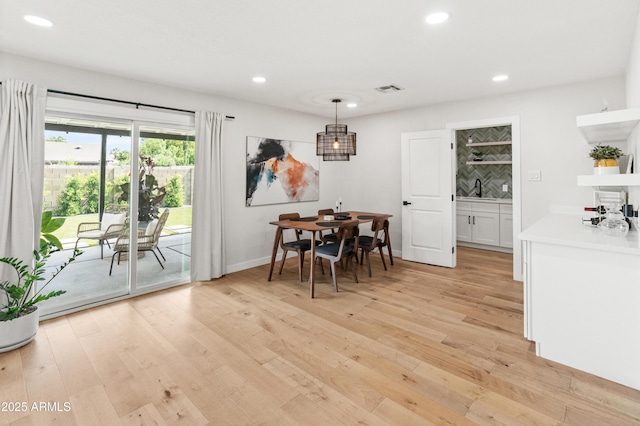 7802 E Hubbell St, Scottsdale, AZ 85257 - dining space featuring recessed lighting, light wood-type flooring, and baseboards