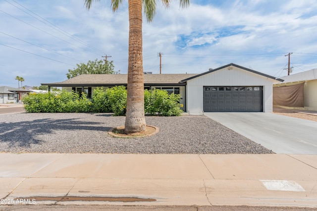 7802 E Hubbell St, Scottsdale, AZ 85257 - ranch-style house featuring concrete driveway, an attached garage, and a shingled roof