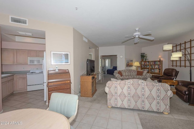 living room featuring ceiling fan and light tile floors