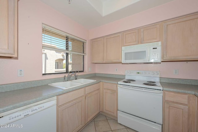 kitchen featuring light tile floors, white appliances, sink, and light brown cabinetry