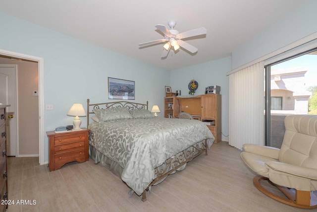 bedroom with light hardwood / wood-style flooring and ceiling fan