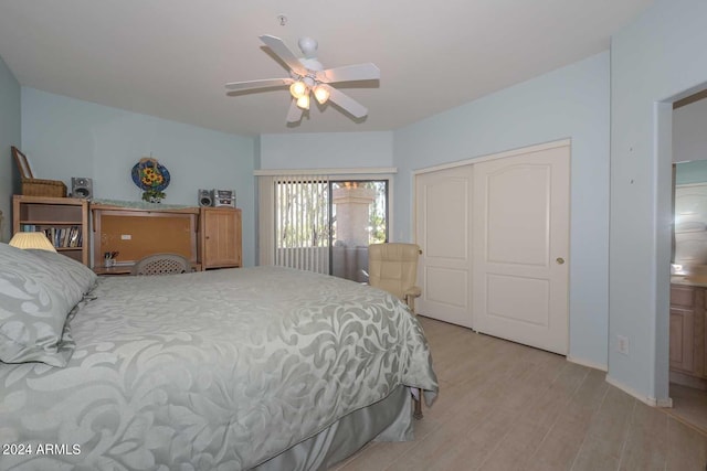 bedroom with a closet, light hardwood / wood-style floors, and ceiling fan