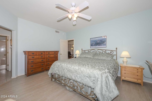 bedroom with light hardwood / wood-style floors and ceiling fan