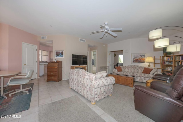 living room featuring light carpet and ceiling fan