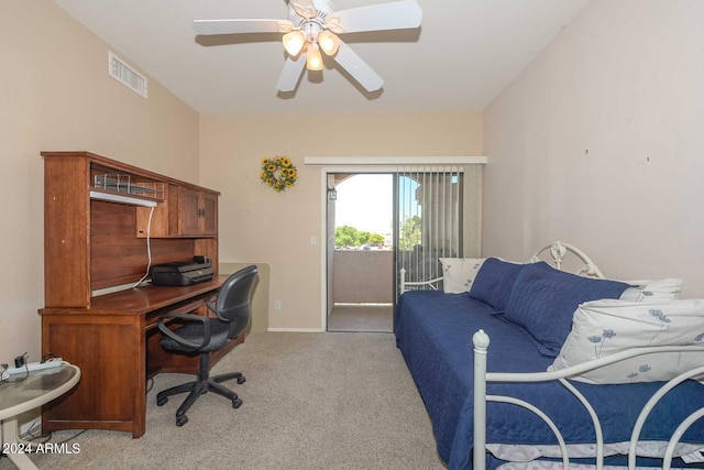 carpeted office featuring ceiling fan