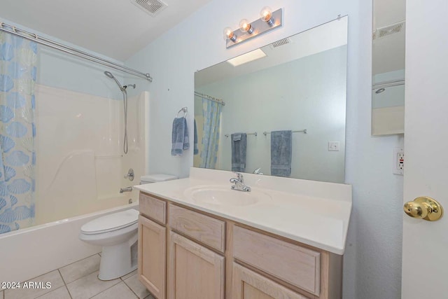 full bathroom with tile floors, vanity, toilet, and shower / tub combo with curtain