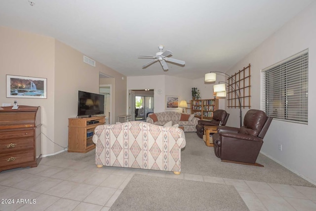 tiled living room with ceiling fan