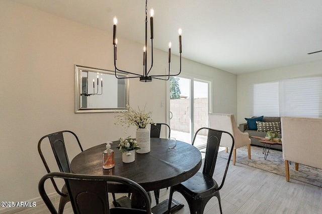 4268 N 68th Ave, Phoenix, AZ 85033 - dining area featuring a chandelier and light wood finished floors
