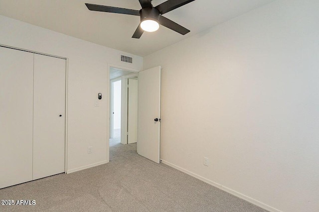 4268 N 68th Ave, Phoenix, AZ 85033 - unfurnished bedroom featuring light colored carpet, a closet, and ceiling fan