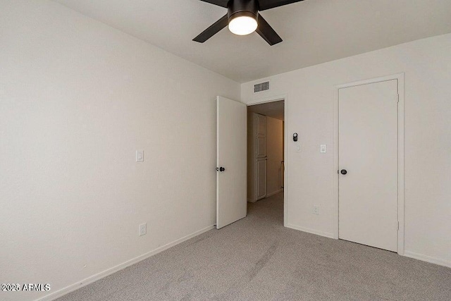 4268 N 68th Ave, Phoenix, AZ 85033 - unfurnished bedroom featuring light carpet and ceiling fan