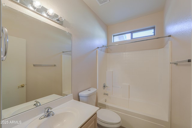 bathroom with visible vents, tub / shower combination, vanity, and toilet