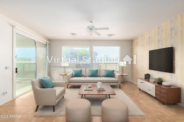 living room with ceiling fan and light tile patterned floors