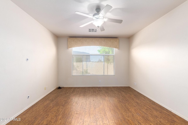 unfurnished room with ceiling fan and wood-type flooring