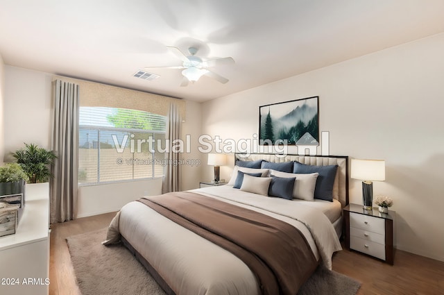 bedroom featuring hardwood / wood-style floors and ceiling fan