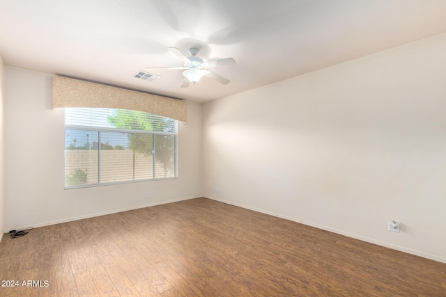 spare room with hardwood / wood-style flooring and ceiling fan