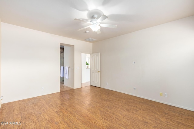 unfurnished room with ceiling fan and light hardwood / wood-style flooring