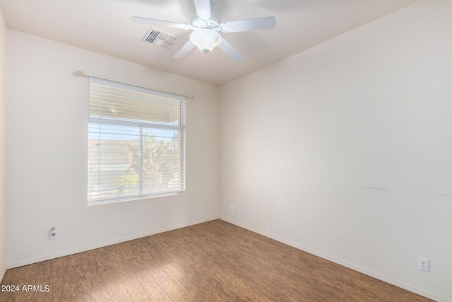 unfurnished room featuring hardwood / wood-style floors and ceiling fan