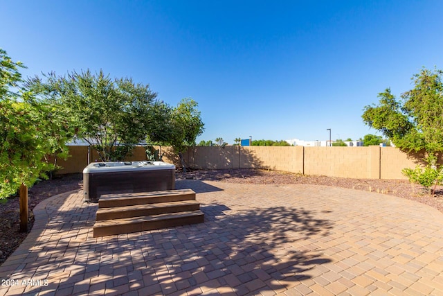 view of patio featuring a hot tub