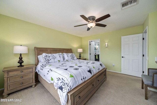 bedroom featuring light colored carpet, visible vents, ceiling fan, and baseboards