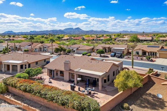 birds eye view of property featuring a mountain view and a residential view