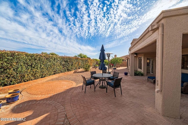 view of patio featuring outdoor dining area