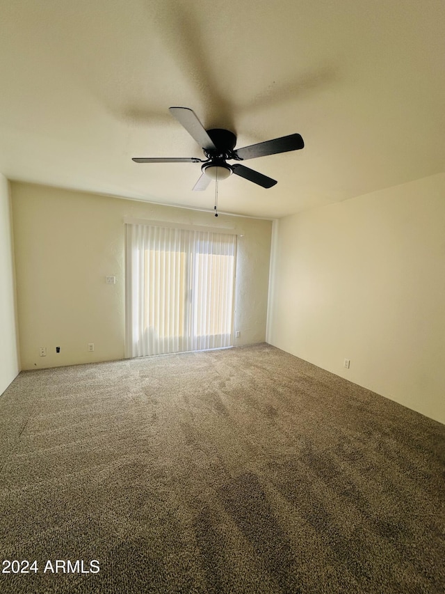 spare room with ceiling fan and carpet floors