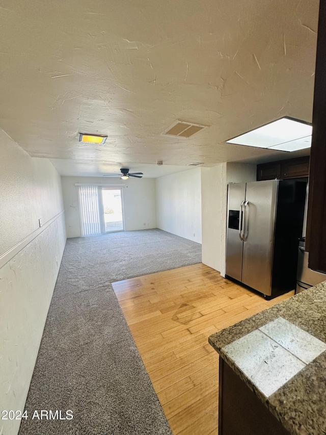 unfurnished room featuring ceiling fan and hardwood / wood-style floors