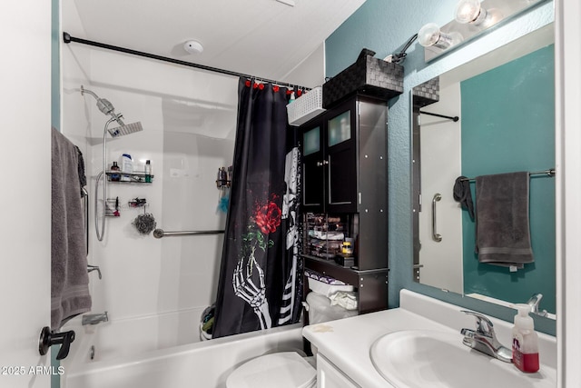 bathroom featuring shower / bath combo, vanity, and toilet