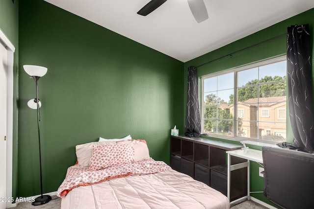 carpeted bedroom featuring multiple windows and lofted ceiling