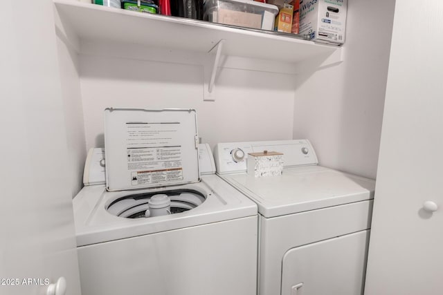 laundry room featuring washer and clothes dryer