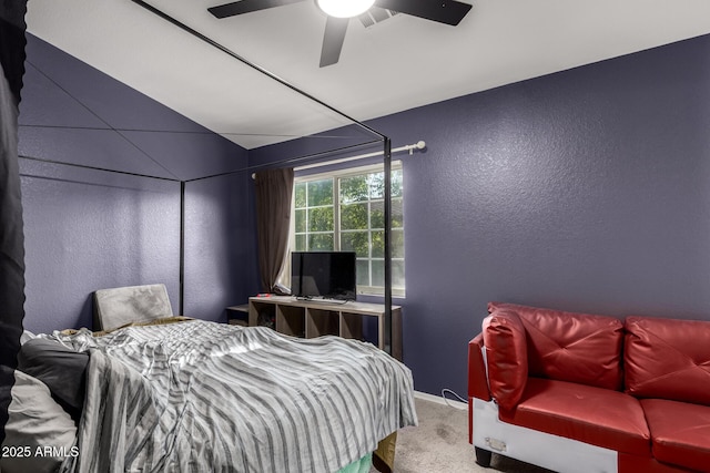 bedroom featuring a textured wall, carpet floors, ceiling fan, and baseboards