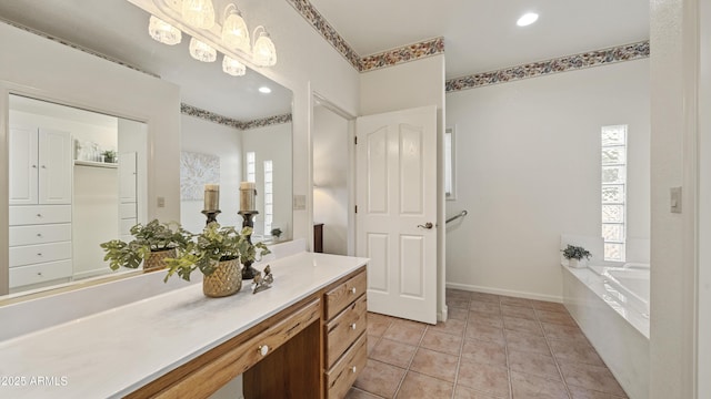 full bath with tile patterned flooring, a washtub, recessed lighting, vanity, and baseboards