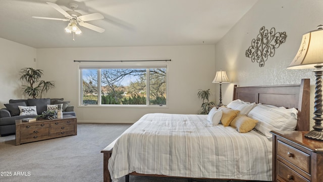 bedroom with ceiling fan and light colored carpet