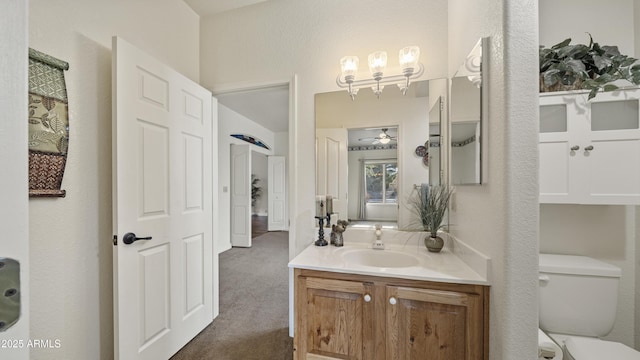 bathroom with toilet and vanity