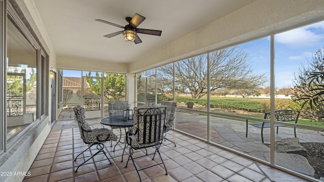 sunroom / solarium with ceiling fan