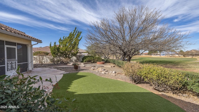 view of yard featuring a patio and fence