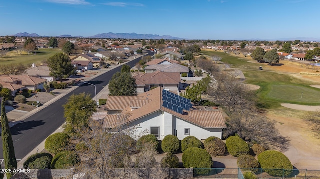 birds eye view of property featuring view of golf course, a residential view, and a mountain view